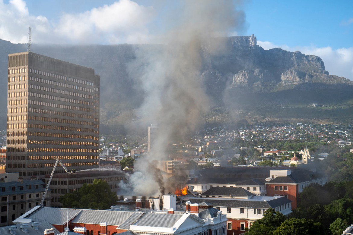 Fire burns at the Houses of Parliament, in Cape Town