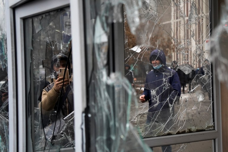 Damaged windows during protests triggered by fuel price increase in Almaty, Kazakhsta
