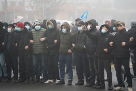 Demonstrators take part in a protest triggered by fuel price increase in Almaty, Kazakhstan
