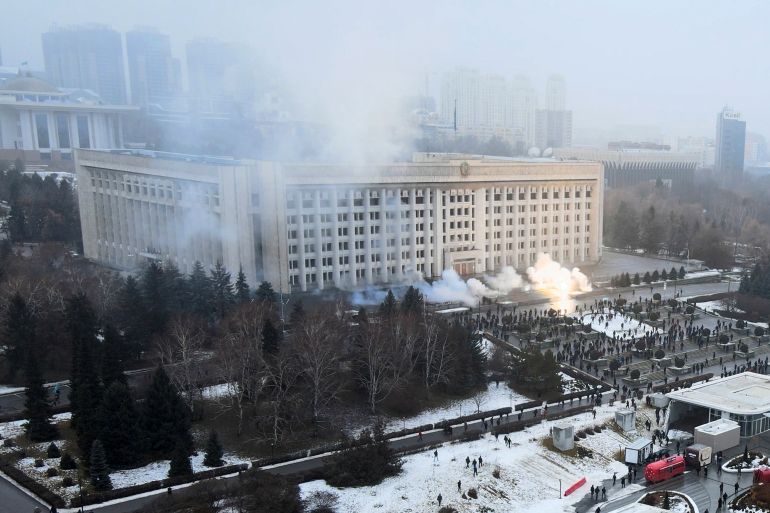 Smoke rises from the city hall building during a protest in Almaty, Kazakhstan