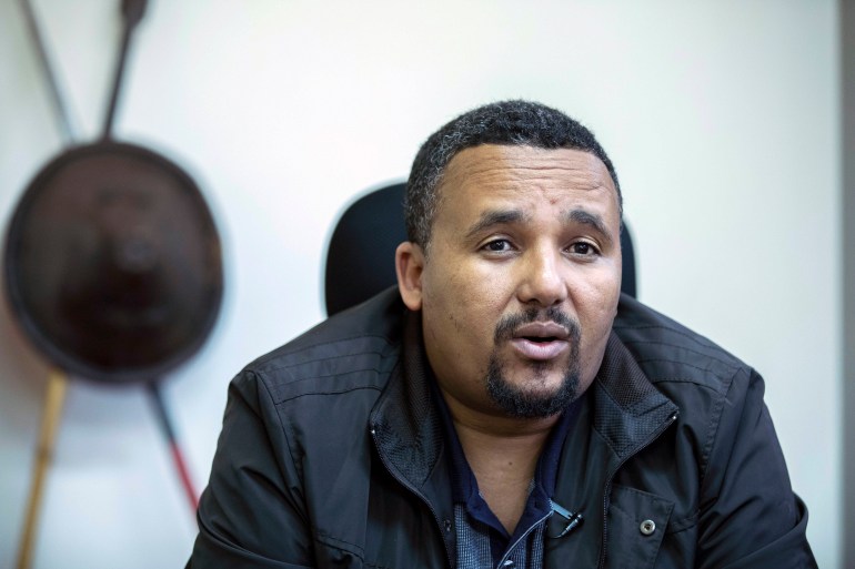 Opposition politician Jawar Mohammed is seen speaking in a room