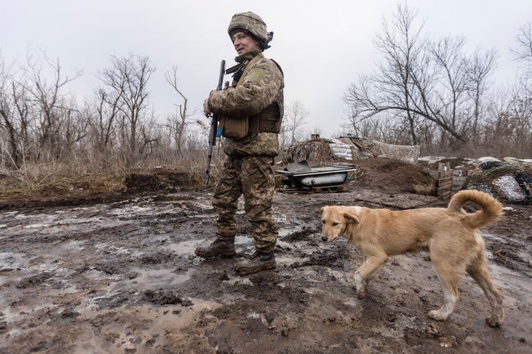 A Ukrainian soldier walks on the line of separation from pro-Russian rebels, Donetsk region
