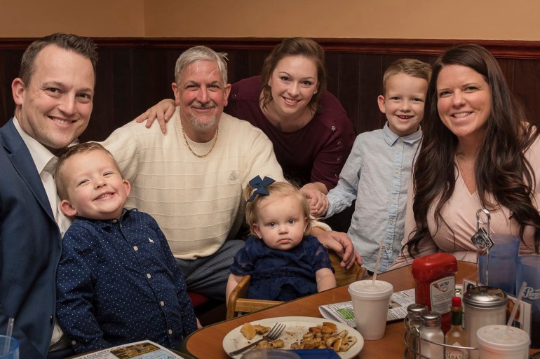 David Bennett, who has terminal heart disease, poses with his family during a meal