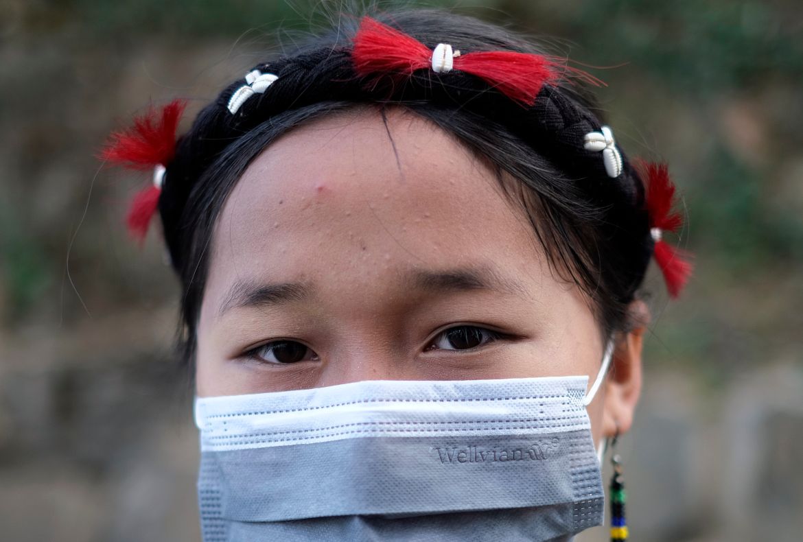 A Naga Woman at the protest with a mask