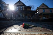 Flowers lay in front of the birthplace of Dr Martin Luther King, Jr, who considered racial equality inseparable from alleviating poverty and stopping war [File: Branden Camp/AP]