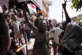 People chant slogans during an anti-coup protest in Khartoum [Marwan Ali/AP Photo]