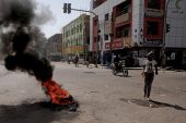 People set up a barricades and burn tires as part of a civil disobedience campaign in Khartoum, Sudan [AP Photo]