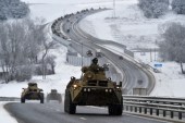 A convoy of Russian armored vehicles moves along a highway in Crimea [AP Photo]