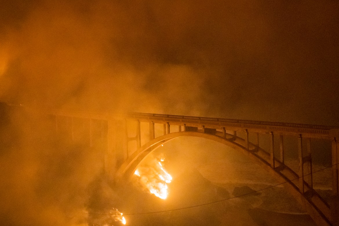The Colorado Fire burns along below Rocky Creek Bridge on Highway 1 near Big Su