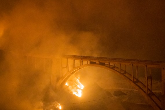 The Colorado Fire burns along below Rocky Creek Bridge on Highway 1 near Big Su
