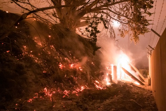 The Colorado Fire burns a fence off Highway 1 near Big Sur