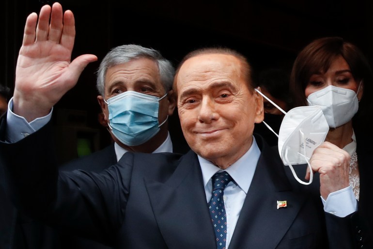 Former Italian Premier Silvio Berlusconi waves