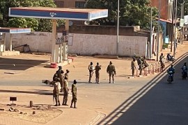 Soldiers stand outside a military base in Burkina Faso's capital Ouagadougou