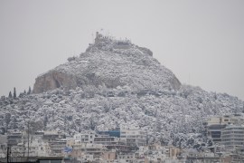 The city of Athens with the Lycabettus hill is covered with snow during a snowfall