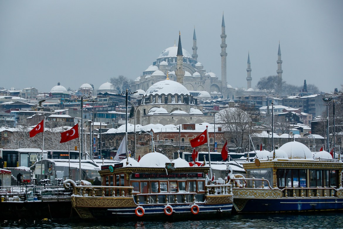 Tourist boats docked in the Golden Horn with Suleymaniye Mosque in the background at Istanbul