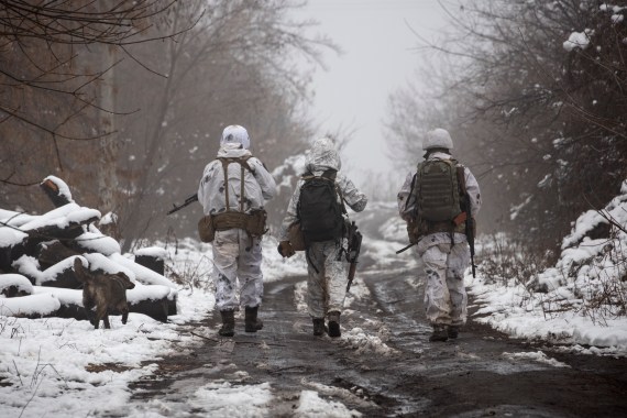 Ukrainian soldiers walk at the line of separation from pro-Russian rebels near Katerinivka, in Ukraine's Donetsk region