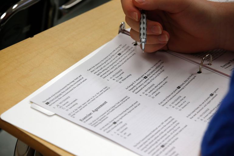 a student looks at questions during a college test preparation class