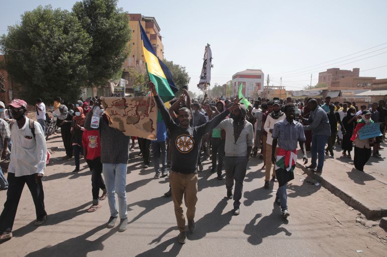 People chant slogans during anti-coup protests in Sudan