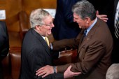 Mitch McConnell talks to Senator Joe Manchin during a joint meeting of Congress in the House Chamber at the US Capitol in Washington, DC, March 25, 2015 [File: Andrew Harrer/Bloomberg via Getty Images]