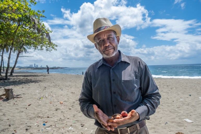 Segundo Maldonado Abreu, a local historian from Bajos de Haina stands on Los Gringos beach