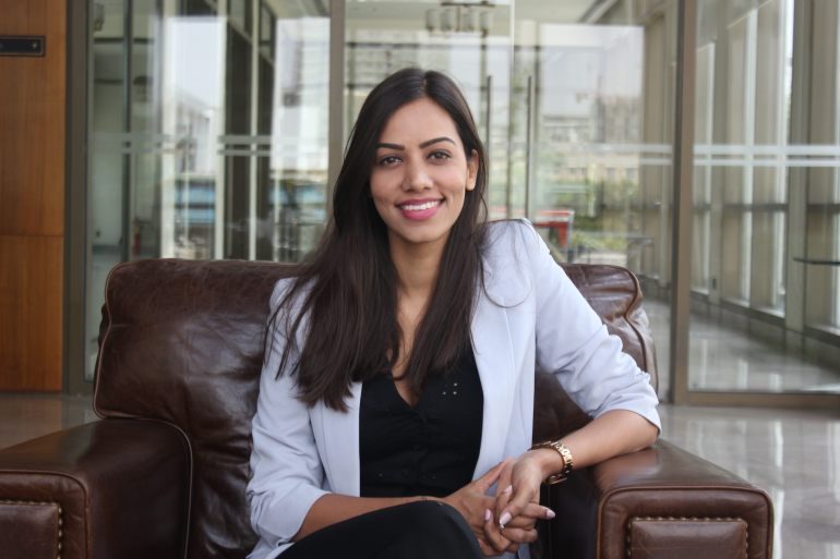Ragini Das, co-founder of women's networking platform leap.club, sitting on a couch in India