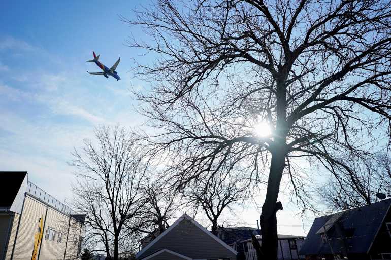 A Southwest Airlines flight, equipped with radar altimeters that may conflict with telecom 5G technology, flies 500 feet above the ground while on final approach to land at LaGuardia Airport in New York City, New York, United States