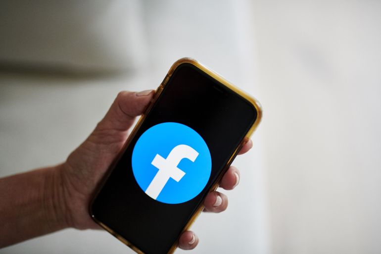 The logo for Facebook on a smartphone