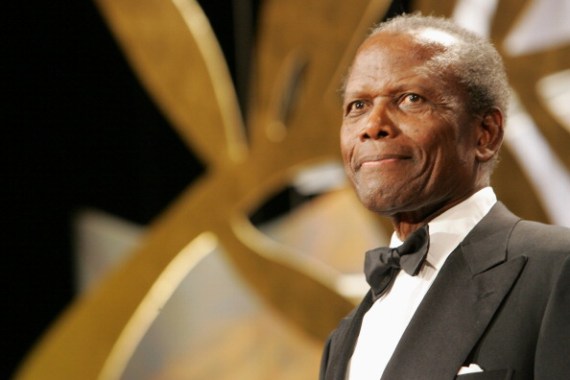 Actor Sidney Poitier stands in front of golden background at the 2006 Cannes Film festival