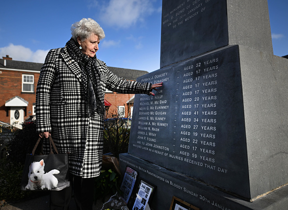 Mary ONeill, aged 81 who helped carry the body of Bloody Sunday victim Damian Donaghy away from the scene visits the Bloody Sunday memorial on January 29, 2022 in Londonderry.