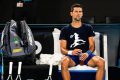 Novak Djokovic of Serbia rests during a practice session ahead of the Australian Open Grand Slam tennis tournament at Melbourne Park in Melbourne, Australia, 14 January 2022.