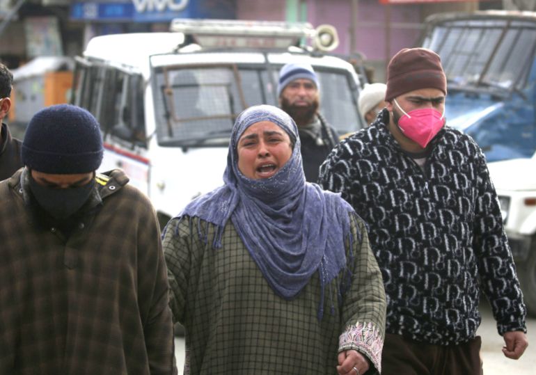 A relative of slain militants wails outside Police Control Room in Srinagar