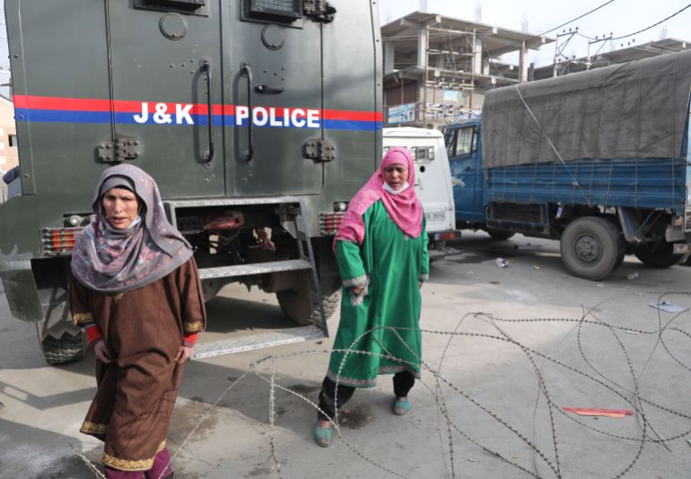 Relative of slain militants walk outside Police Control Room in Srinagar