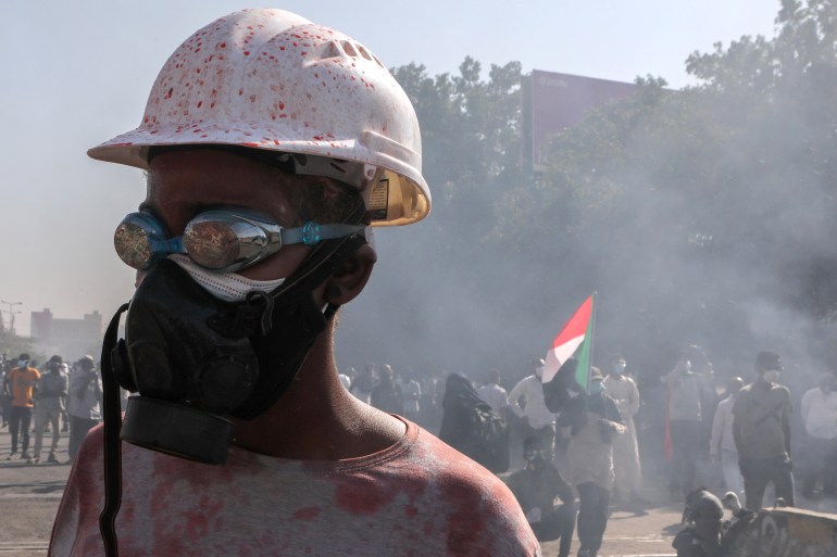 Sudanese protesters clash with security forces during a protest against military coup, in Khartoum, Sudan, 30 January 2022.