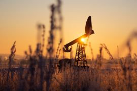 An oil pumping jack in an oil field in Russia