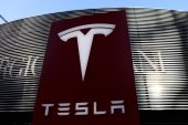 Tesla&#39;s revenue rose to $17.72bn in the fourth quarter, from $10.74bn a year earlier [File: Tingshu Wang/Reuters]