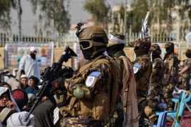 Members of the Taliban Badri 313 military unit stand guard