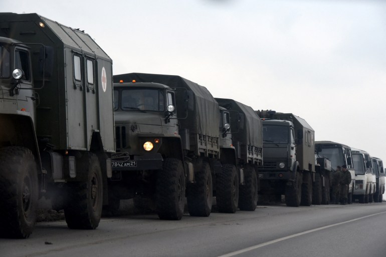 A convoy of Russian military trucks and buses