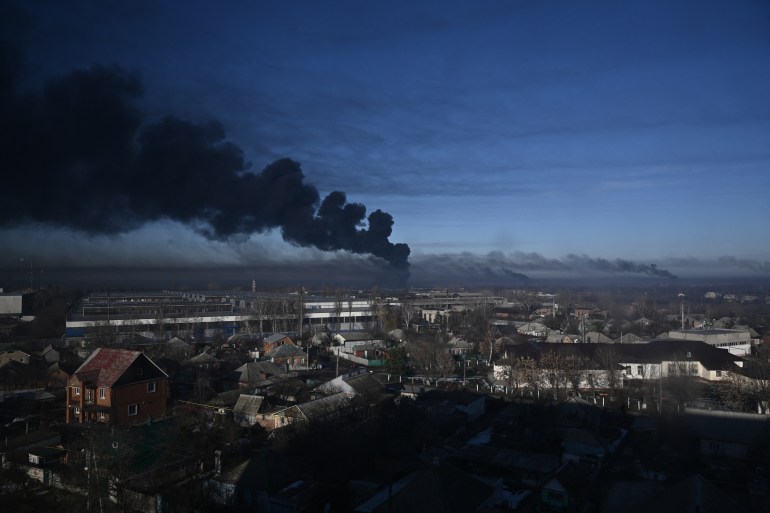 Black smoke rises from a military airport in Chuguyev near Kharkiv