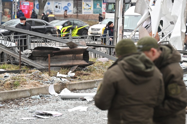 The remains of a shell is seen on a street in Kyiv