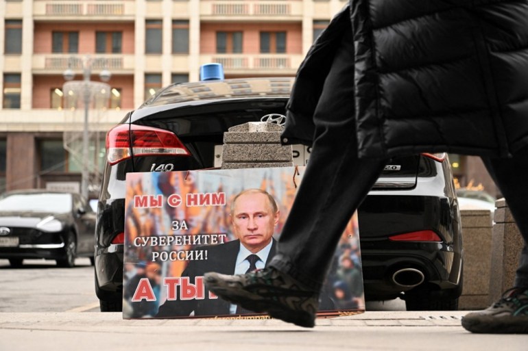 Putin poster saying "we are with him"