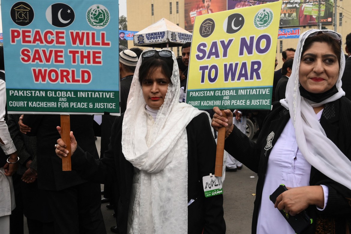 Lawyers hold placards during a protests against war and Russia's invasion of Ukraine in Lahore