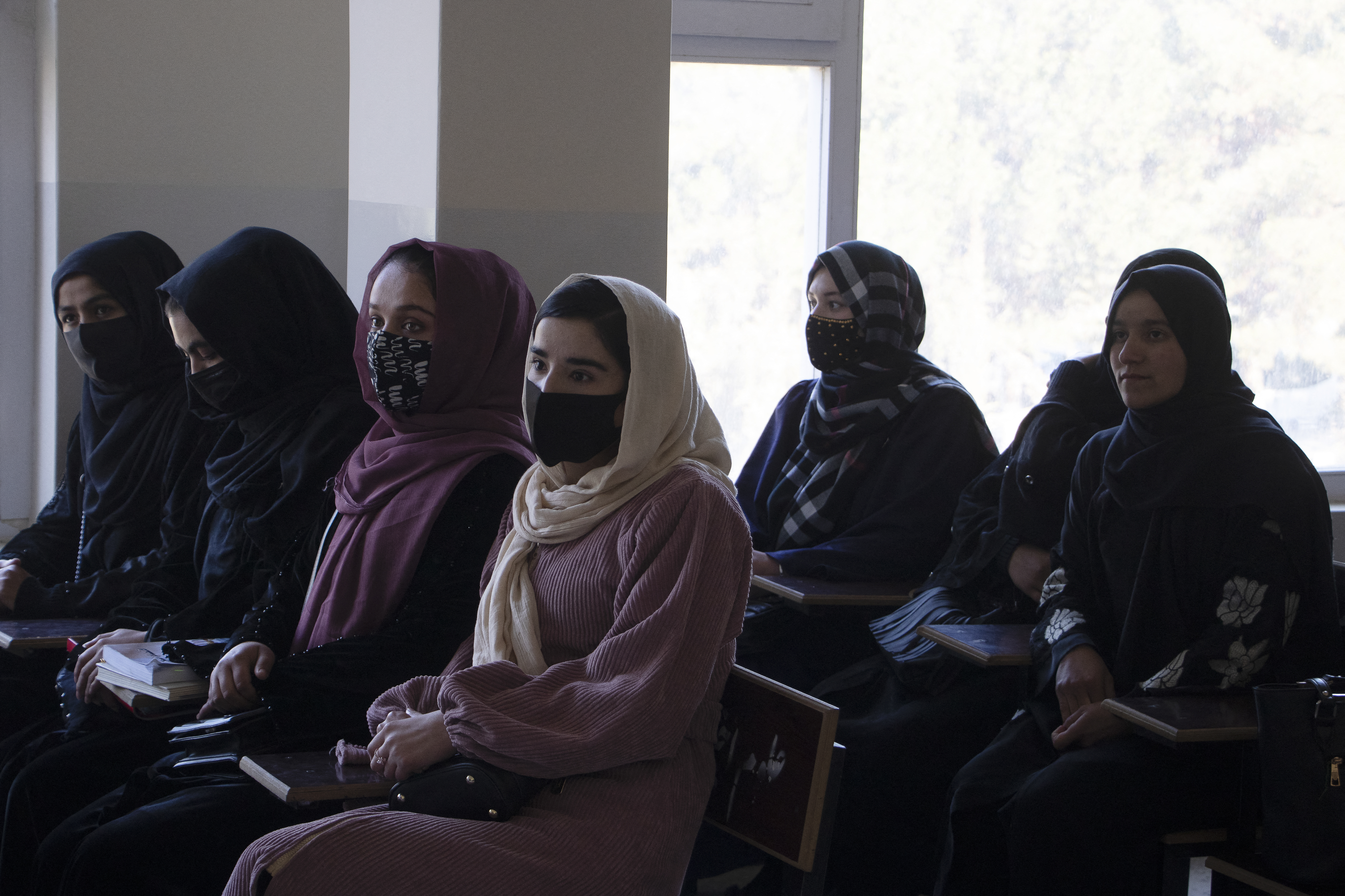 Female students attend a class at Badakshan University