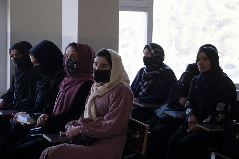 Female students attend a class at Badakshan University