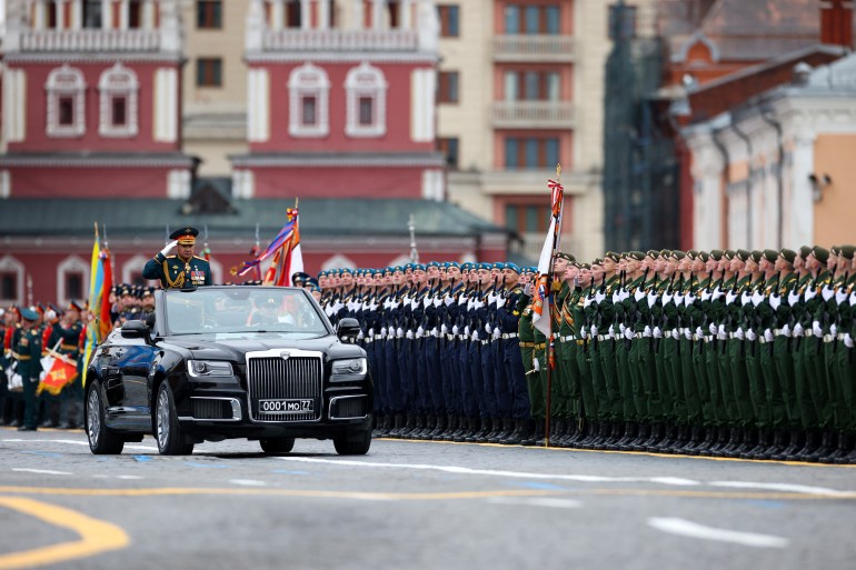 Russian Defence Minister Sergei Shoigu salutes to soldiers as he is driven along Red Square during the Victory Day military parade in Moscow on May 9, 2021. - Russia celebrates the 76th anniversary of the victory over Nazi Germany during World War II. (Photo by Dimitar DILKOFF / AFP)