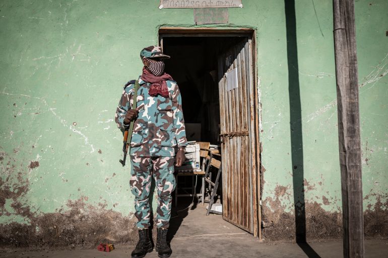 A police officer looks on outside the prison in Mehal Meda, Ethiopia