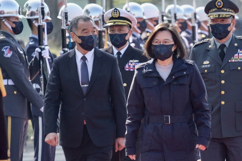 Taiwan President Tsai Ing-wen (front right) is escorted by Defence Minister Chiu Kuo-cheng (front left) attend a ceremony at a navy base in Kaohsiung in January