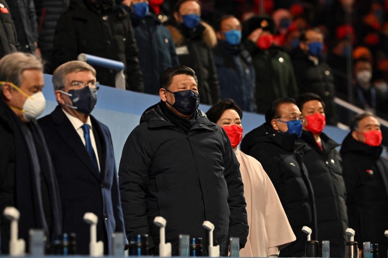 UN Secretary-General Antonio Guterres, International Olympic Committee President Thomas Bach, Chinese President Xi Jinping and his wife Peng Liyuan stand during the opening ceremony of the Beijing 2022 Winter Olympic Games.