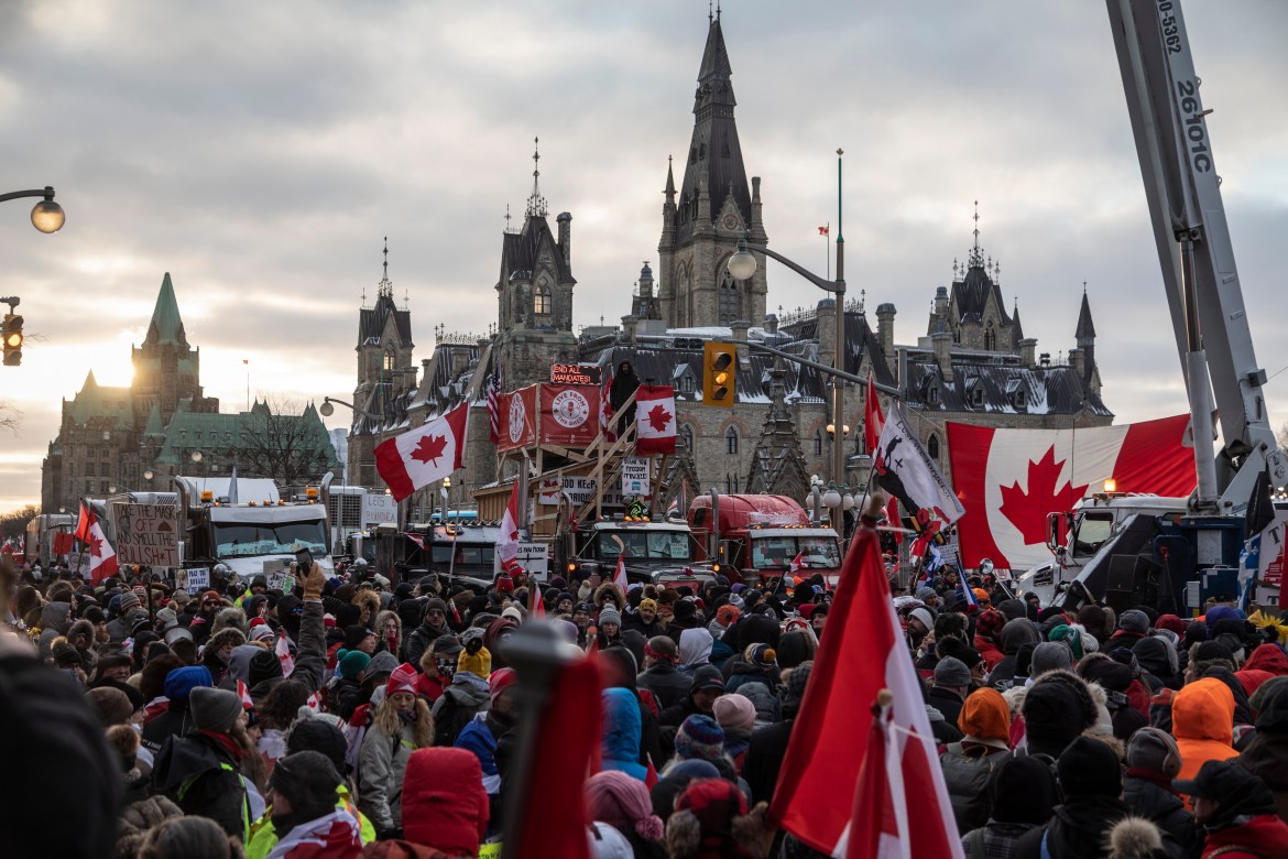 Protesters massed on Wellington street in front of the Canadian Parliament Buildings