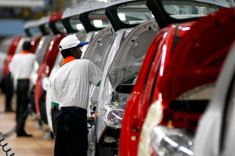 Workers assemble cars at Hyundai's newly inaugurated second plant near Chennai in India