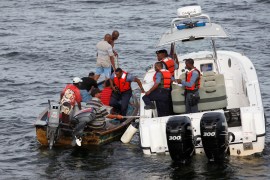 A Trinidad and Tobago coast guard interceptor vessel stops to search a boat during a patrol